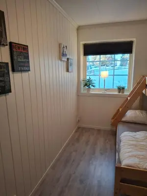 a room with a bunk bed and a window at Bjørgebu Camping AS in Nord-Fron