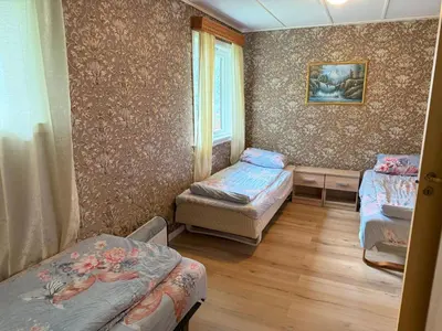 a room with two beds and a window at Holiday Home Stabben white House by Interhome in Aure