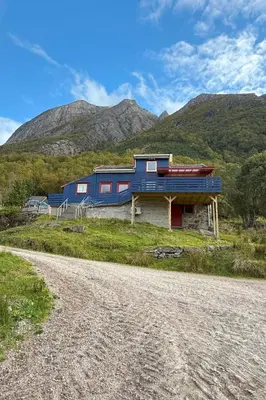 a blue house on the side of a mountain at Holiday Home Stabben Blue House by Interhome in Storsæter