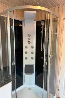 a shower in a small room with a shower at Holiday Home Stabben Blue House by Interhome in Storsæter