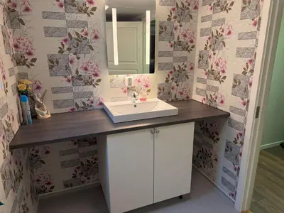 a bathroom with a sink and a mirror at Holiday Home Stabben Blue House by Interhome in Storsæter