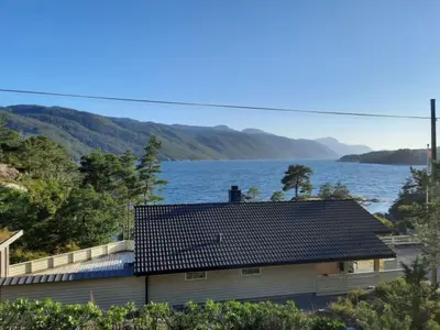 a house with a view of a body of water at Holiday Home mit Blick auf das Wasser by Interhome in Hebnes