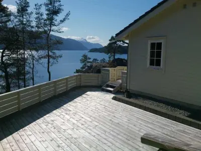 a patio of a house with a view of the water at Holiday Home mit Blick auf das Wasser by Interhome in Hebnes