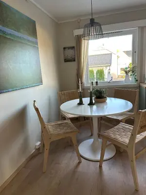 a dining room with a table and chairs and a window at Great house Hamar, stay close to Mjøsa at Domkirkeodden in Hamar