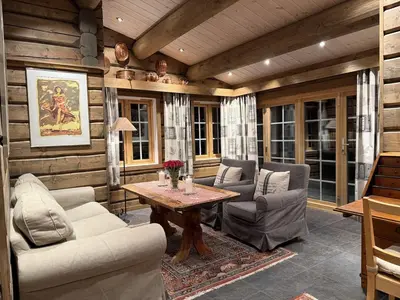 a living room with two chairs and a table at Large cottage with beautiful view in Trysil in Trysil