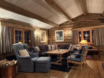 a living room with a couch and a table at Large cottage with beautiful view in Trysil in Trysil