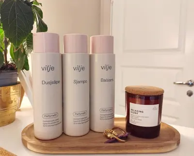 a group of three products sitting on a wooden tray at Women Only - Guestroom in centre of Førde town in Førde