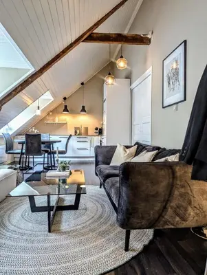 a living room with a couch and a table at Apartment centrally located in Trondheim in Trondheim