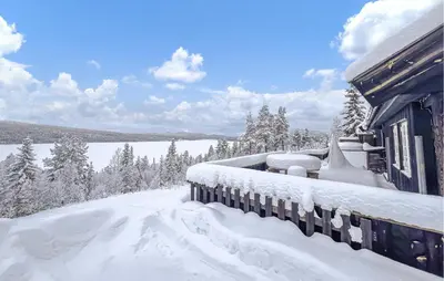 a house covered in snow next to a snow covered yard at Awesome Home In Gålå With Sauna in Gålå