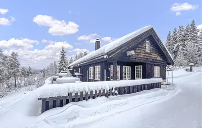 a house covered in snow in front at Awesome Home In Gålå With Sauna in Gålå