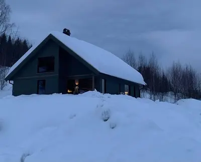 a building with snow on the top of it at New and great cabin at the foot of Norefjell in Noresund