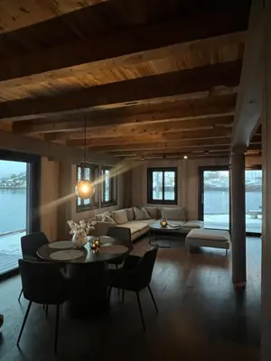 a living room with a couch and a table at Amundøya Seaside in Kristiansund