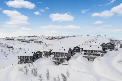 a ski lodge in the snow on a mountain at Kikut Alpin Lodge 2204 in Hol