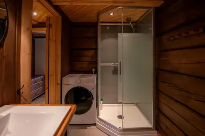 a bathroom with a washing machine and a washer at Trysilfjellet Sør 802 Anex in Trysil