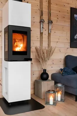 a living room with a fireplace and a couch at Skarhaug Panorama Lodge in Stranda