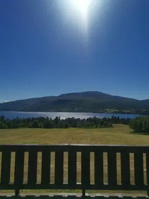 a bench with a view of a body of water at Åsrud seter i Jotunheimen in Randsverk