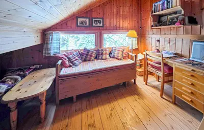 a living room with a couch and a table at 4 Bedroom Awesome Home In Rjukan in Rjukan