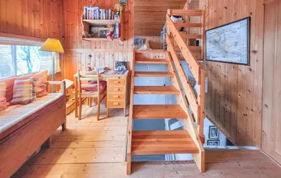 a staircase in a tiny house with a desk at 4 Bedroom Awesome Home In Rjukan in Rjukan