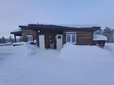 a house with a pile of snow in front of it at Hytte Hummelfjell, Os in Os