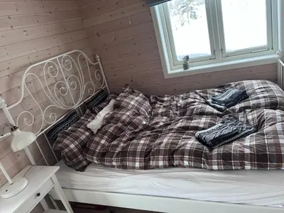 a bed with two pillows on it in a room at Hytte Hummelfjell, Os in Os