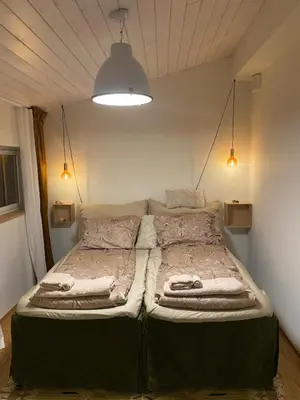 a bedroom with two beds in a room at Modern, spacious top apartment in Lii