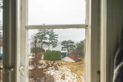 an open window with a view of a yard at NEW Listing! Unique Villa in Bergen in Bergen