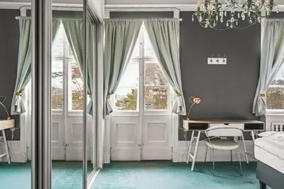 a bedroom with a desk and a bed and a window at NEW Listing! Unique Villa in Bergen in Bergen