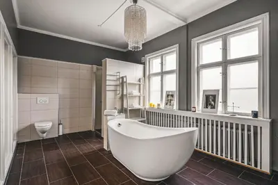 a bathroom with a white tub and a toilet at NEW Listing! Unique Villa in Bergen in Bergen
