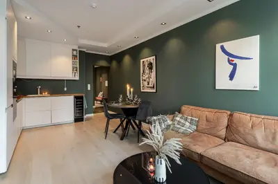a living room with a couch and a table at NEW! I Modern Comfort in the Heart of Bergen in Bergen
