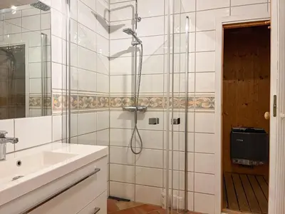 a bathroom with a shower and a sink at Bjønabakkens oase in Beitostøl