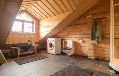 a bathroom with a toilet in a wooden cabin at Awesome Apartment In Bjorli With Wifi in Bjorli