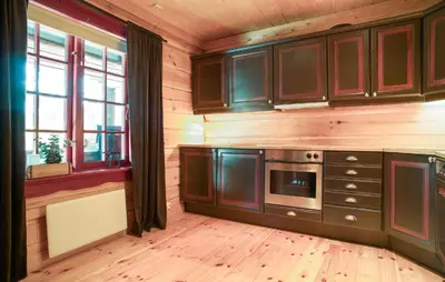 a kitchen with wooden walls and wooden floors at Awesome Apartment In Bjorli With Wifi in Bjorli