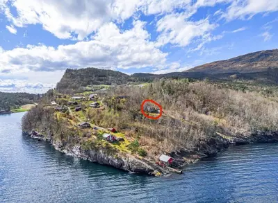 an island in the water with a red circle on it at Look at this view! 3 BR house overlooking Hardangerfjorden in Kvam