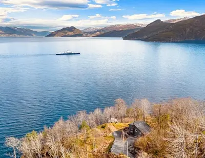 a boat on a large body of water at Look at this view! 3 BR house overlooking Hardangerfjorden in Kvam