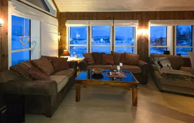 a living room with couches and a coffee table at Cozy Home In Rauland With Sauna in Rauland