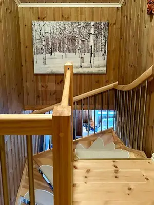 a crib in a wooden room with a tv at Cabin By Main Ski Trail At Norefjell in Eggedal