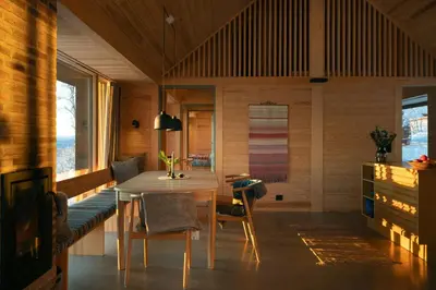 a dining room with a table and chairs at Architect-Designed Cabin With Ski Trail Near Geilo in Ål