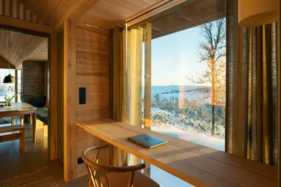 a room with a desk and a large window at Architect-Designed Cabin With Ski Trail Near Geilo in Ål