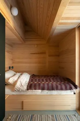 a bed in a room with a wooden ceiling at Architect-Designed Cabin With Ski Trail Near Geilo in Ål