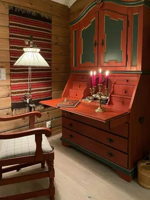 a room with a dresser with candles and a lamp at Family-Built Cabin At The Three Line in Eggedal