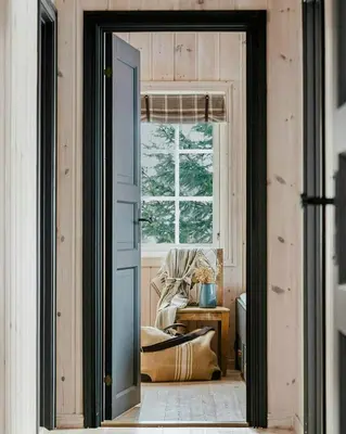 an open door into a room with a chair and a window at Cabin With Panoramic Views Of Jotunheimen in Gålå