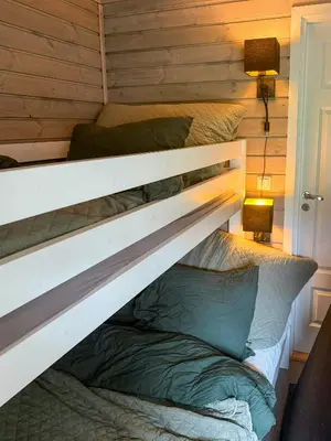 a bunk bed in a tiny house at Mountain Cabin With Sauna Atop Fageråsen in Trysil
