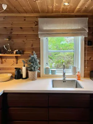 a kitchen with a sink and a window at Mountain Cabin Near Gaustatoppen And Måsafjell in Tuddal