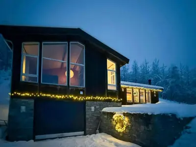 a house with christmas lights on the side of it at Wonderful Cottage For Active Families In Hemsedal in Hemsedal