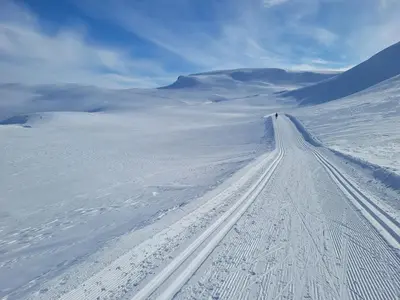a road in the middle of a snow covered field at Mountain Cabin With Ski Access In Høgevarde in Flå