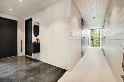 a hallway of a house with a mirror at Stylish Cabin Near Oppdal Ski Centre in Oppdal