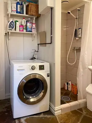 a washing machine in a bathroom with a shower at Log Cabin With Panoramic Views At Skeikampen in Svingvoll