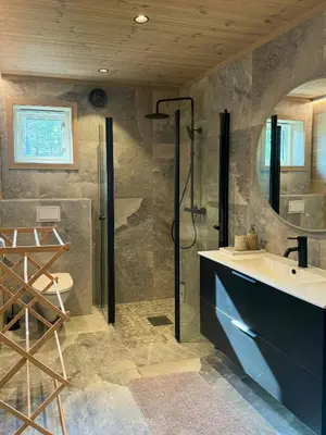 a bathroom with a sink and a shower at Modern Cabin For Large Families In Oppdal in Oppdal