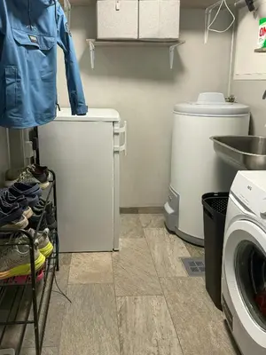 a laundry room with a sink and a washing machine at Modern Cabin For Large Families In Oppdal in Oppdal