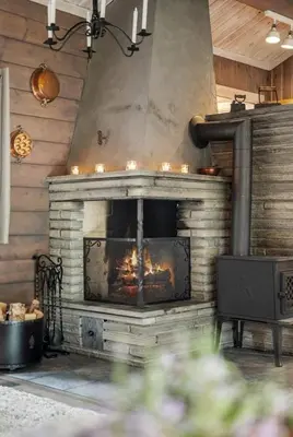 a brick fireplace with a fire in it at Family-Friendly Cabin With Zipline Near Oppdal in Rennebu